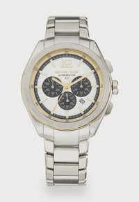 Cronografo in acciaio inossidabile argentato con quadrante bianco, dettagli dorati, sottodial neri e lunetta tachimetrica. Include un bracciale.