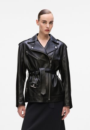 Black leather motorcycle jacket with a belted waist, zip pockets, and silver hardware accents. Features a notched lapel and tailored fit.