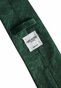 Grön paisley-mönstrad slips av texturerad tyg, med en ögla för att hålla och en etikett med texten "John Henric" och "Made in Italy".