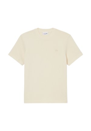 T-shirt en maille crème à manches courtes de Lacoste avec col rond et motif texturé subtil.