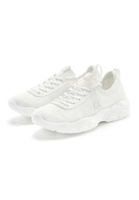 White athletic shoes with a breathable mesh upper, round toe, and chunky sole featuring wavy texture. Laces and pull tabs for easy wear.
