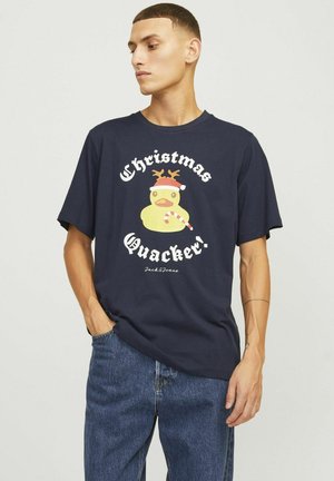 Dunkelblaue Baumwoll-T-Shirt mit kurzen Ärmeln, ausgestattet mit einer gelben Enten-Grafik, die einen Weihnachtsmann-Hut und Geweih trägt, Text "Weihnachtsquacker!"