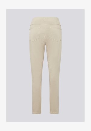 Beige, fitted trousers with a smooth texture. Features two back pockets, stitched detailing, and a comfortable waistband.