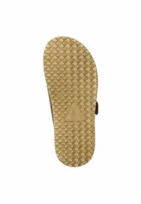 Semelle d'une sandale avec un motif texturé en nid d'abeille de couleur marron clair. Un logo triangulaire en relief est visible près du talon.