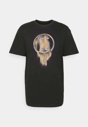 T-shirt en coton noir à manches courtes, avec un motif circulaire au design dégradé dans des tons de gris et d'or au centre.