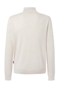 Beiger Strickpullover mit hohem Kragen, langen Ärmeln und gerippten Bündchen. Glatte Textur mit einem dezenten Muster, mit einem seitlichen Etikett.