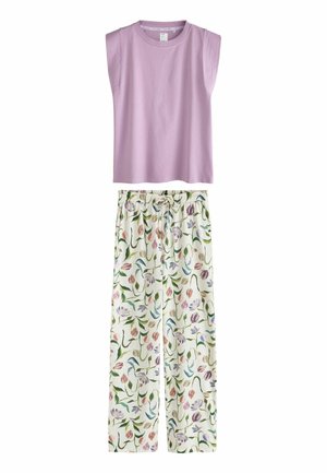 Ujjatlan levendulaszínű felső, fehér, bőszárú nadrággal párosítva, amely színes virágmintával és rugalmas derékpánttal rendelkezik.