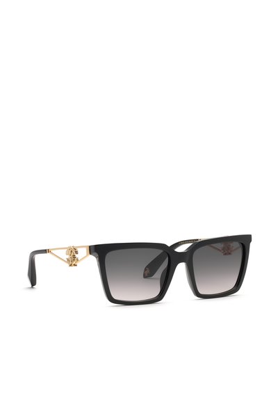 Lunettes de soleil carrées noires avec verres foncés dégradés et emblème décoratif doré sur les branches, sur fond blanc.