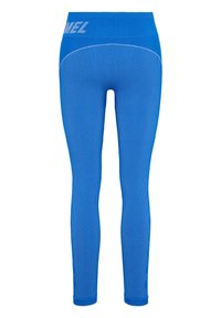 Blå träningsleggings i ribbat tyg. Hög midja med logotypdetalj. Figursydda och slutar vid ankeln med släta fållar.