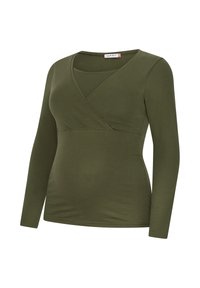 Langärmliges Oberteil in Olivgrün mit überkreuztem V-Ausschnitt. Weicher, dehnbarer Stoff mit figurbetonter Passform und nahtlosem Abschluss.