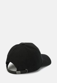 Black cotton baseball cap featuring an adjustable strap and a metal accent, with a rounded crown and a slightly curved brim.