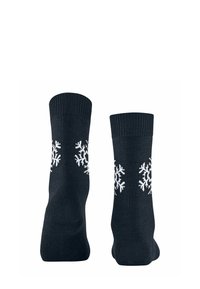 Ciemnoniebieskie skarpetki z prążkowanymi manszetami, ozdobione białymi wzorami śnieżynkami po zewnętrznych stronach. Wykonane z miękkiego materiału dzianinowego.