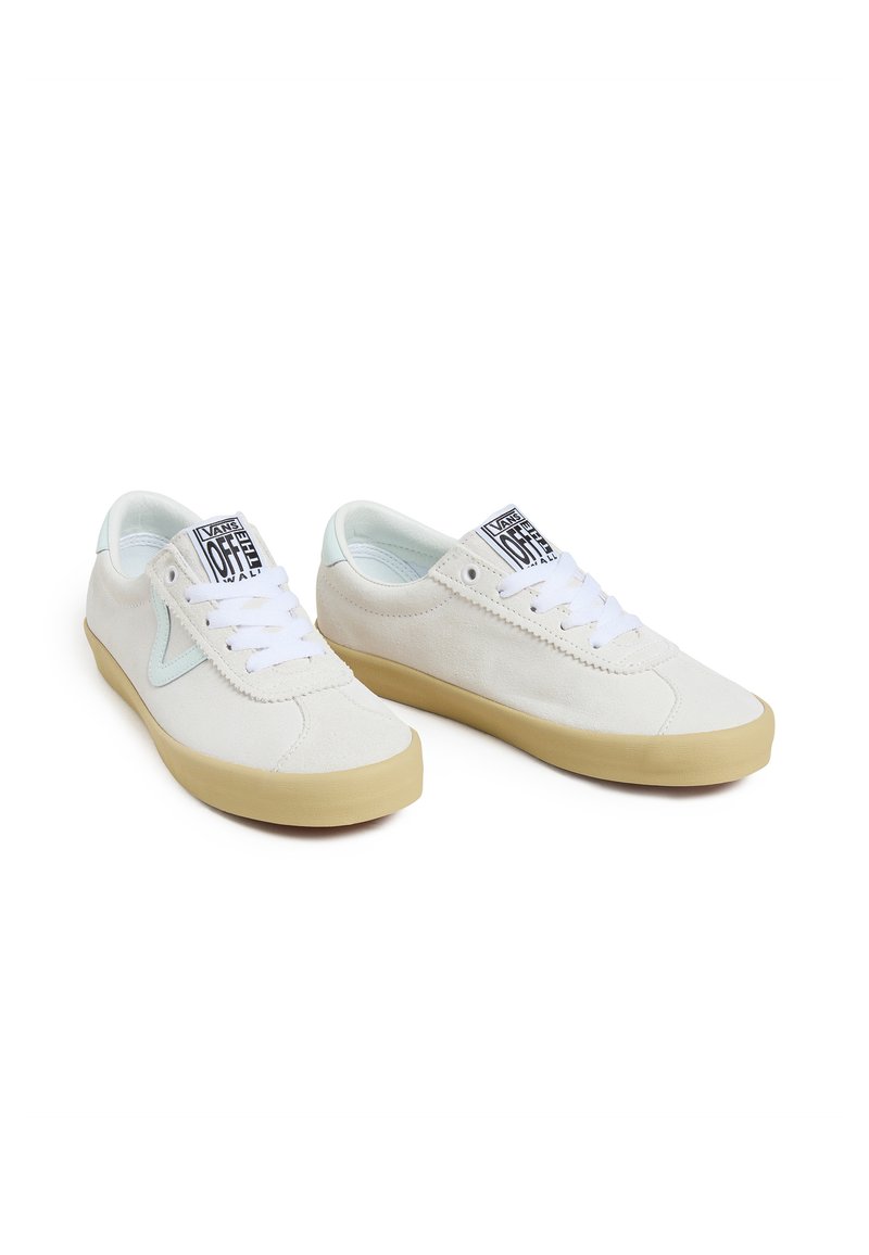 White canvas sneakers with mint green accents, lace-up design, rounded toe, and rubber sole. Features logo on tongue and clean stitching.
