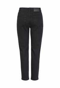 Svarte denimjeans med slim fit, fem lommer og en glatt tekstur. Har et logo-patch på baksiden av midjebåndet.