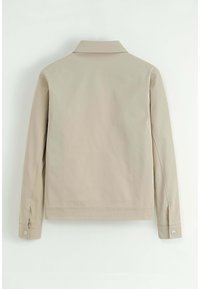 Veste beige avec un col, des manches longues et des poignets boutonnés. Tissu lisse avec un design sobre à l'arrière, minimaliste sans poches ni ornements.