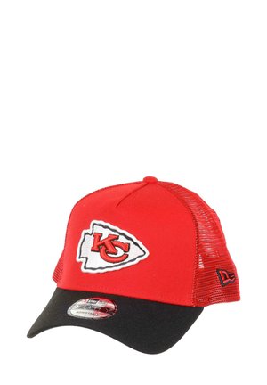Red and black trucker cap with a mesh back, featuring an embroidered white and red "KC" logo on a shield-shaped patch.