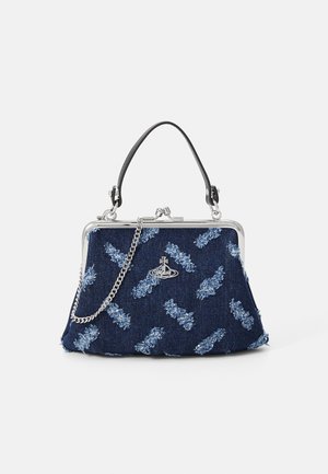 Denim handbag with a silver clasp, chain strap, and blue floral texture. Features a black handle and intricate embroidered patterns.