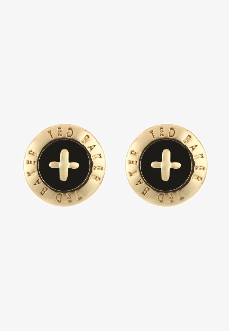 Boucles d'oreilles rondes Ted Baker ton or avec centres noirs et un motif en forme de croix au centre, nom de la marque gravé autour des bords.