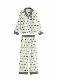 Weißes Schlafanzugset mit schwarzem Regenschirm-Muster, langärmelige, durchknöpfbare Oberteile mit Tasche und passenden, elastischen Hosen mit gemusterten Bündchen.