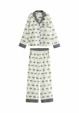 Weißes Schlafanzugset mit schwarzem Regenschirm-Muster, langärmelige, durchknöpfbare Oberteile mit Tasche und passenden, elastischen Hosen mit gemusterten Bündchen.
