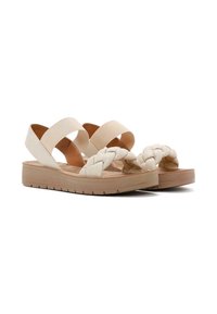 Sandali beige con parte anteriore intrecciata e cinture incrociate. Realizzati in materiale sintetico, presentano una suola ammortizzata e una suola in gomma testurizzata.