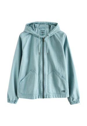 Világoskék cipzáras kapucnis pulóver húzózsinórokkal, két első zsebbel, rugalmas mandzsettákkal és laza szabással.