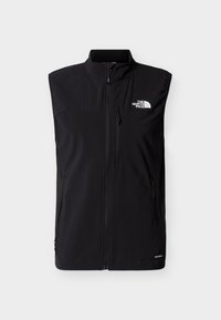 Chaleco negro sin mangas con cremallera, cuello alto, bolsillos con cremallera en el pecho y los laterales, y logo blanco de The North Face en el pecho.