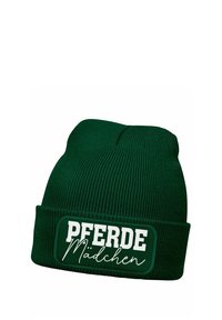 Dark green knit beanie with a folded cuff, featuring a rectangular patch that displays "PFERDE Mädchen" in white lettering.