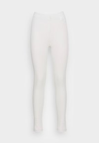 Leggings brancos com um padrão texturizado, material elástico, design ajustado e uma cintura elástica, apresentando um acabamento suave e sem hardware visível.