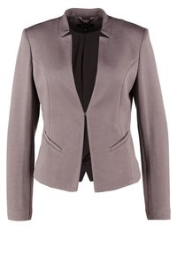 Blazer pour femme sur mesure en tissu gris texturé avec manches longues, col cranté, fermeture éclair à l'avant et deux poches frontales passepoilées.