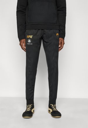 UFC ZENITH FIGHT NIGHT MENS JOGGER - Pantalones deportivos - black/gold-coloured
