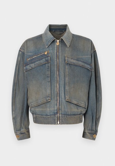 Denim jacket in medium blue with a zip front, two front pockets, and ribbed hem. Features a classic collar and gold-tone hardware accents.