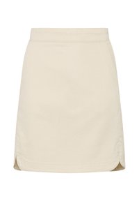 Mini-jupe en coton beige avec une taille ajustée, des poches sur les côtés et des fentes discrètes sur le bas pour plus de mobilité.