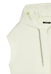 Jasnozielona bezrękawnik z zamkiem błyskawicznym, z przeszyciem ze sznurkiem w czarno-białe wzory oraz gładką teksturą materiału.