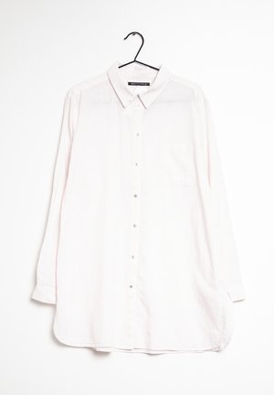Light pink long-sleeve shirt with a button-up front, collared neckline, vertical stripes, and a single chest pocket. Soft fabric texture.