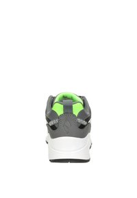 Gray athletic shoe with a white sole, green interior, and reflective accents. Features a mesh upper and pull tab at the heel.