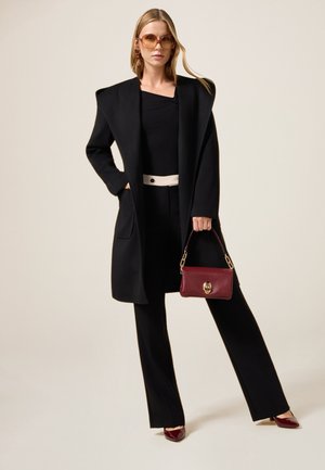 WITH CONTRASTING DETAIL - Broek - nero