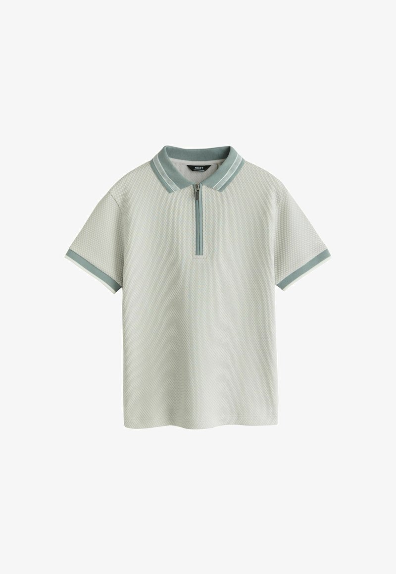 Īsroku adīts polo krekls ar fakturētu audumu, zaļu apkakli un piedurkņu apmalēm, priekšpusē ar rāvējslēdzēju.