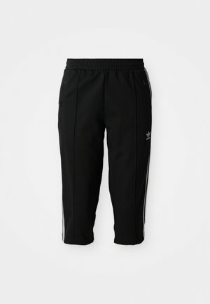 Pantaloni sportivi neri con vita elastica, tasche laterali con zip e strisce bianche lungo le cuciture. Realizzati in un materiale liscio e durevole.