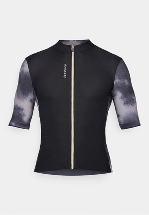 Maillot de cyclisme à manches courtes avec un corps noir côtelé et des manches grises texturées à motif dégradé, accompagné d'une fermeture éclair à l'avant et d'un logo.