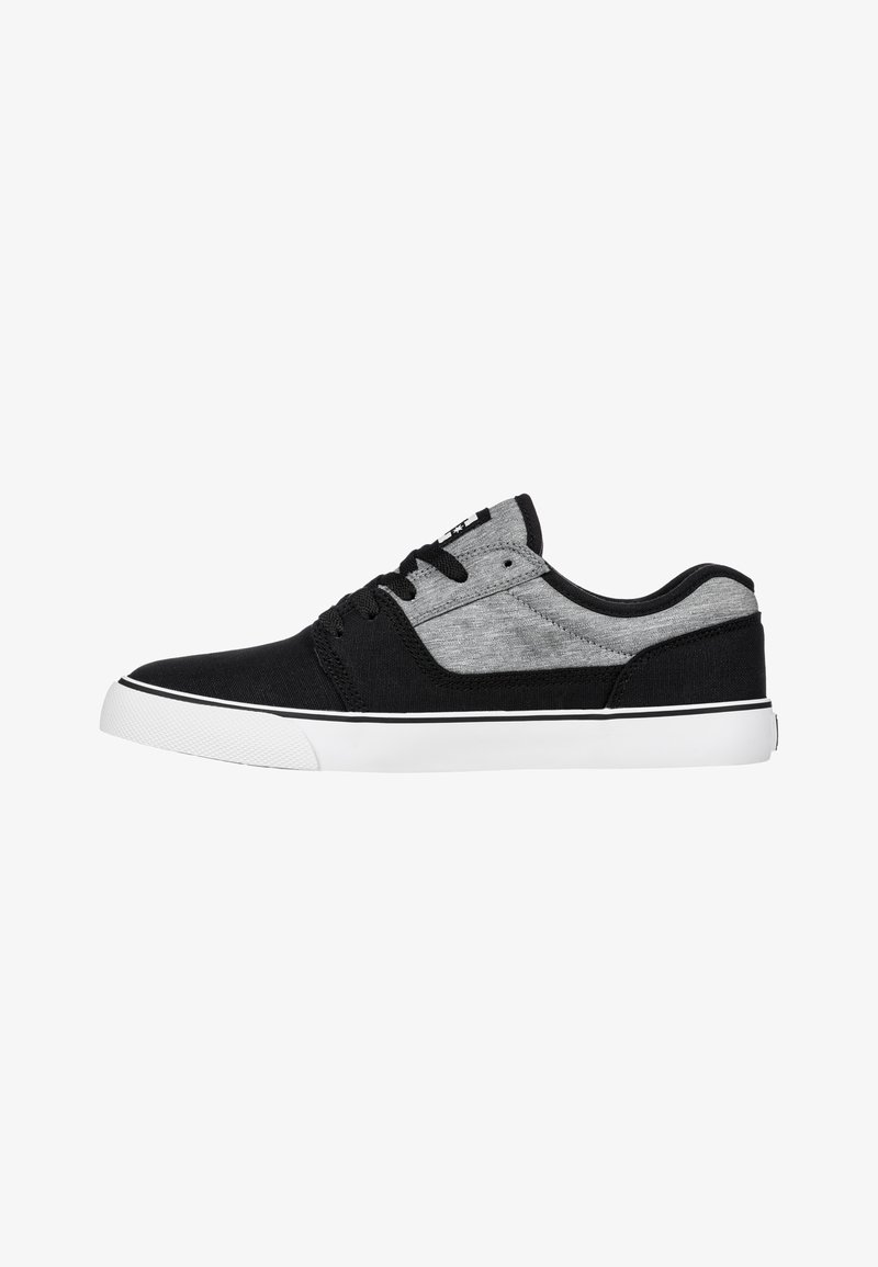 Black and gray canvas sneaker with a white rubber sole, rounded toe, lace-up front, and contrasting textures on the sides.