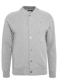 Gray sweatshirt jacket made of soft fabric, featuring a round collar, front snap buttons, side pockets, and ribbed cuffs. Simple design.