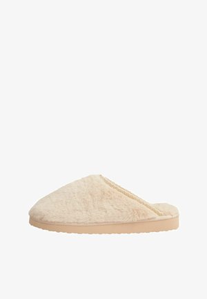 Pantofole in pelliccia beige a forma rotonda, con una parte superiore testurizzata e una suola piatta in gomma chiara. Presentano un delicato accento in pizzo lungo il bordo.