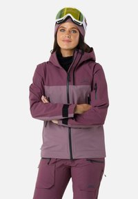Ski jakke i nuancer af mauve og lilla, med h�ætte, lynlåslommer, elastiske manchetter og åndbart stof til udendørs aktivitet.
