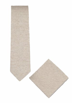 Beige textured necktie and matching pocket square on a white background, both made of woven fabric.