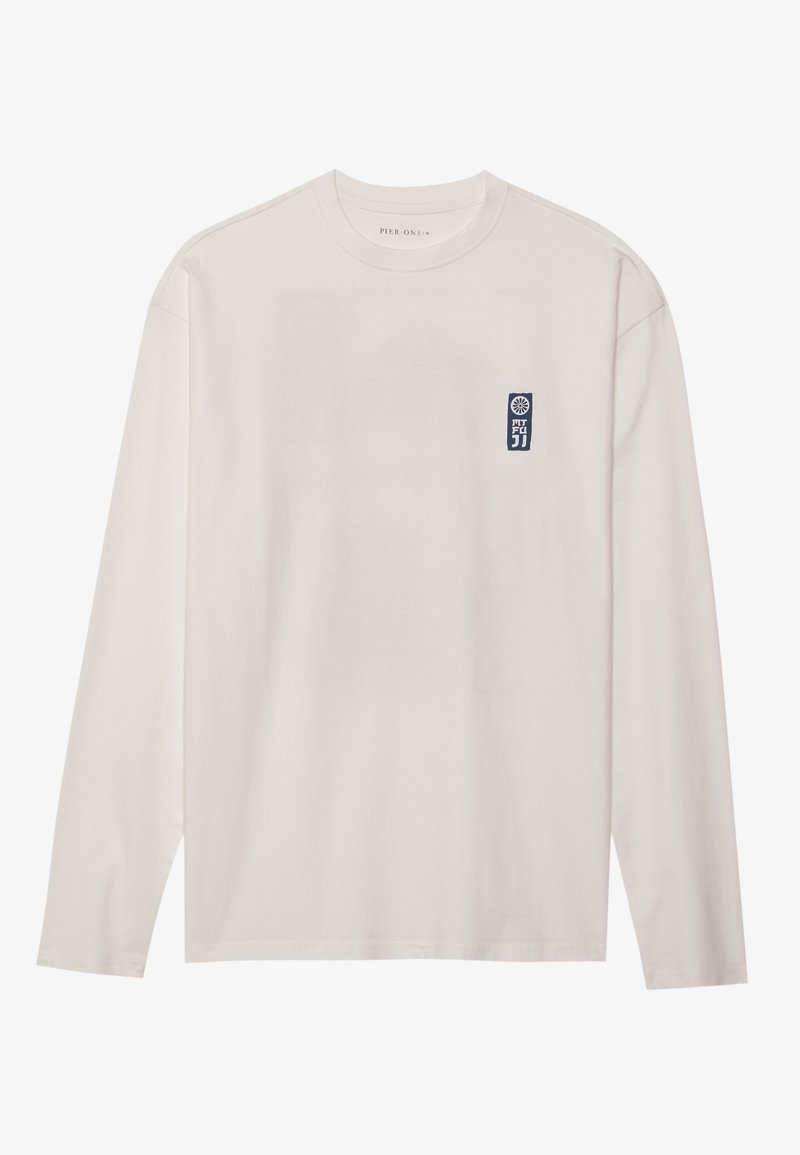 Long-sleeve white T-shirt made of cotton, featuring a small blue logo label on the upper left chest and a crew neckline.