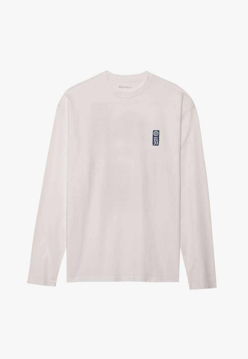 Long-sleeve white T-shirt made of cotton, featuring a small blue logo label on the upper left chest and a crew neckline.