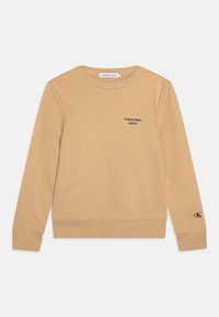 Béžová mikina z měkké tkaniny, s kulatým výstřihem, žebrovanými manžetami a spodním lemem, se malým černým logem Calvin Klein Jeans.