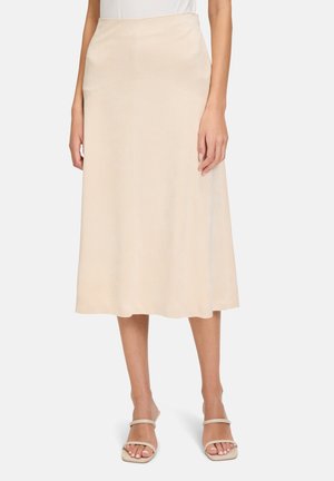 Beige midi skirt made from soft fabric, featuring a smooth texture, a fitted waist, and a subtle A-line shape.
