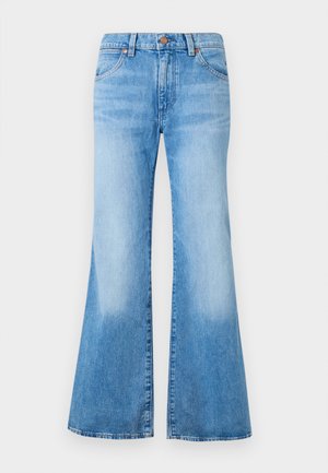 Svetle modré zvonové džíny s vysokým pasem, vyrobené z denimu. Obsahují dvě přední kapsy a kovové detaily na knoflících. Na látce je dodán vybledlý vzhled.